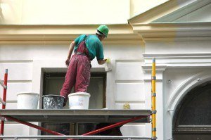 Execution of restoration works. The house painter behind work.